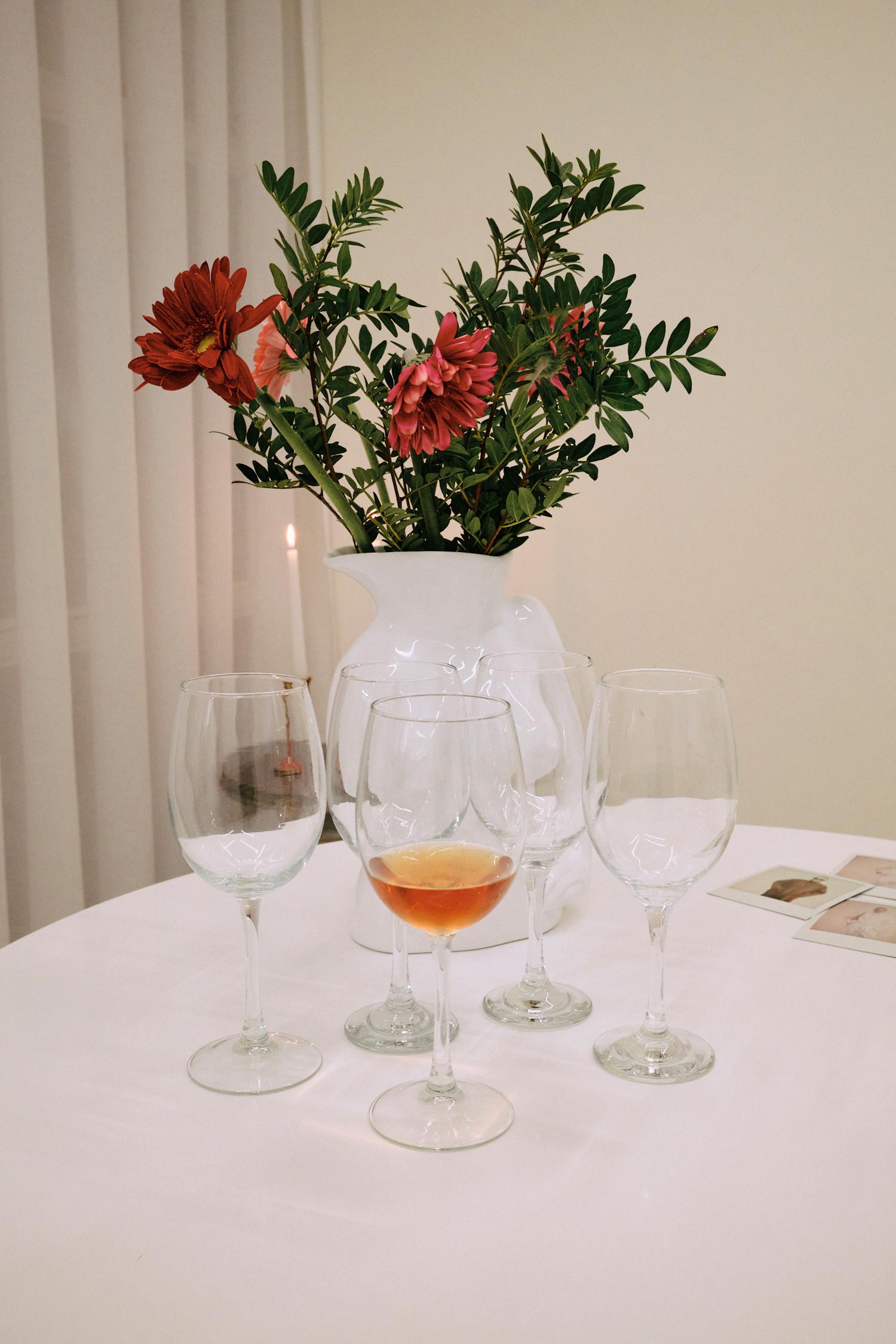 Elegant flower arrangement with wine glasses